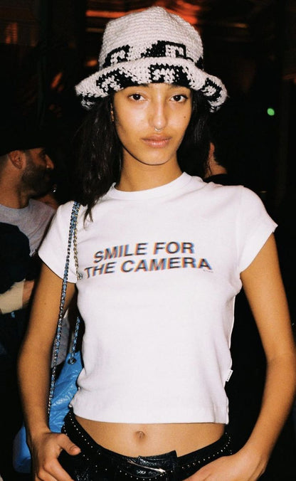 Smile For The Camera baby tee in White — AMHYPE Baddie Edition quote tee