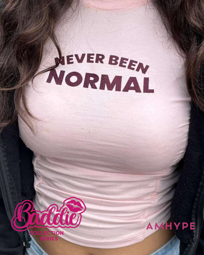 Never Been Normal baby tee in Baby Pink — AMHYPE Baddie Edition quote tee