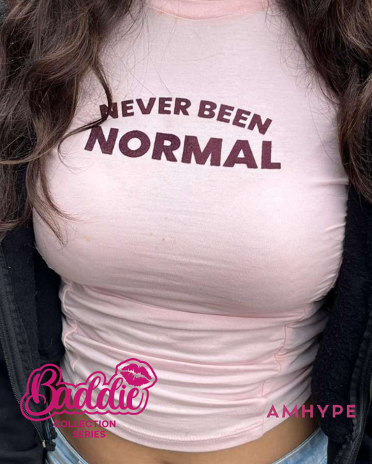 Never Been Normal baby tee in Baby Pink — AMHYPE Baddie Edition quote tee