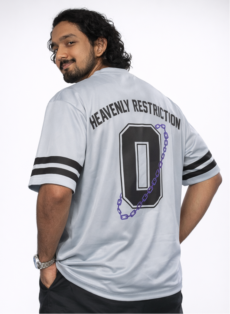 Person wearing a white sports jersey with 'Heavenly Restriction' text and number 0 on a plain background