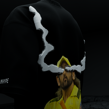 Close-up back detail of amhype MS Dhoni Crown 7 tee — 3D white cloud smoke halo framing Dhoni CSK portrait on black 260 GSM drop shoulder tee