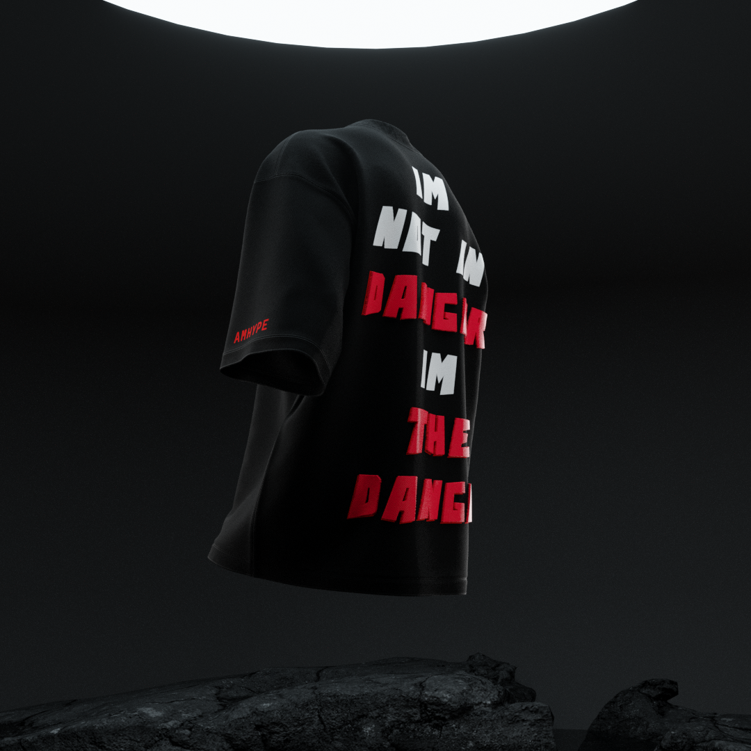 Side angle of amhype Heisenberg I'm The Danger oversized tee — 3D puff back typography and AMHYPE red sleeve branding on black 260 GSM drop shoulder tee