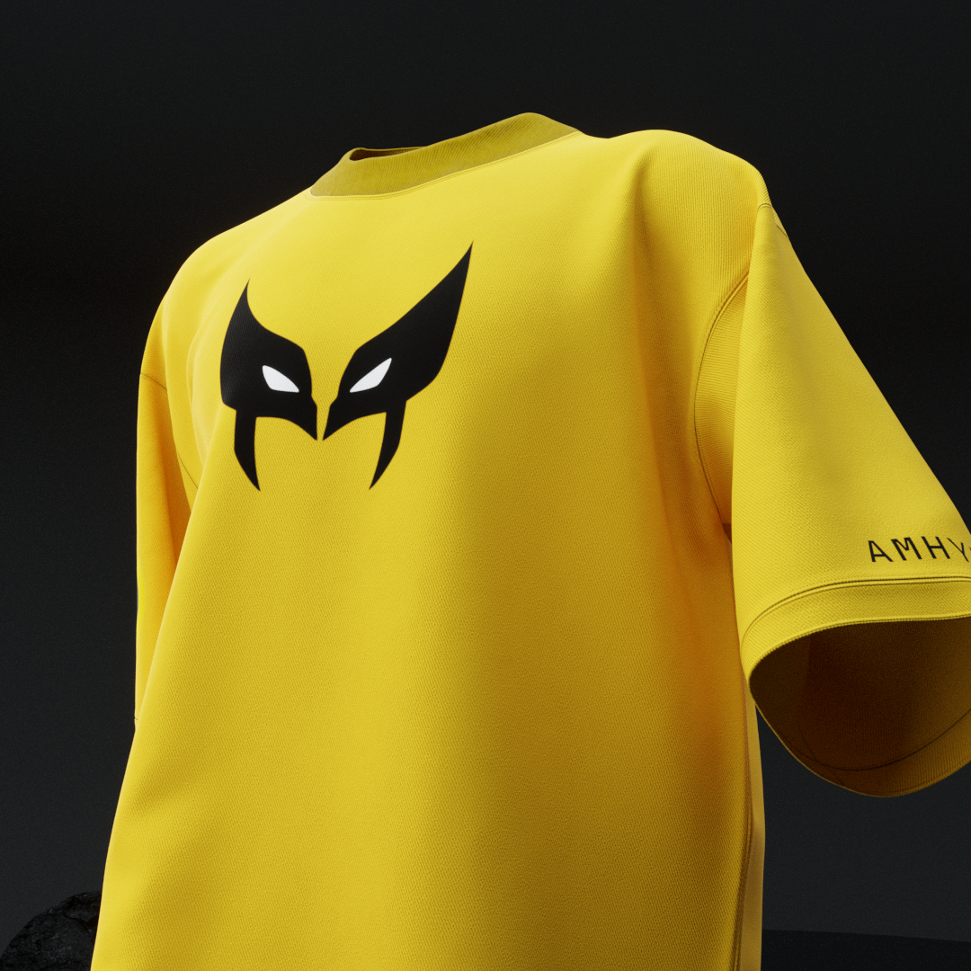 Close-up front of amhype Wolverine X-Men oversized tee — black Wolverine mask logo with white eyes centre chest on yellow drop shoulder tee